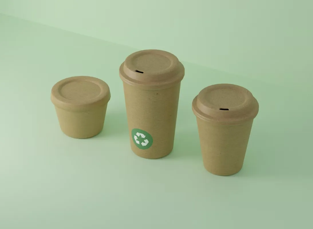 Three kraft paper cups with lids, one marked with a recycling symbol